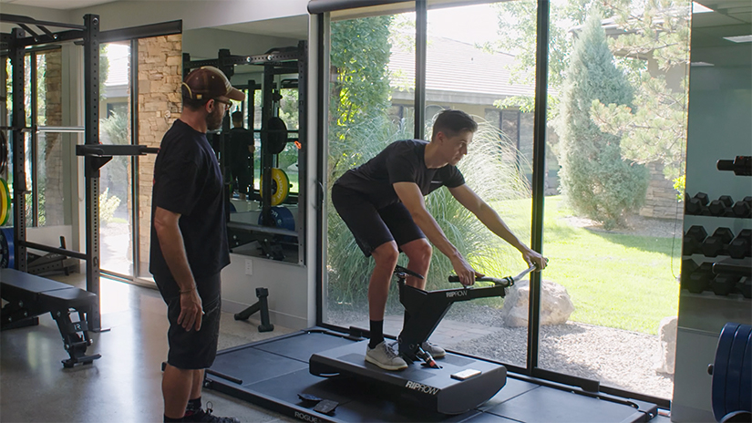 Here Nate displays the mountain biking technique of the hip hinge on a rip row trainer. His hips are hinged at 45 degrees with the knees behind the bottom bracket. 