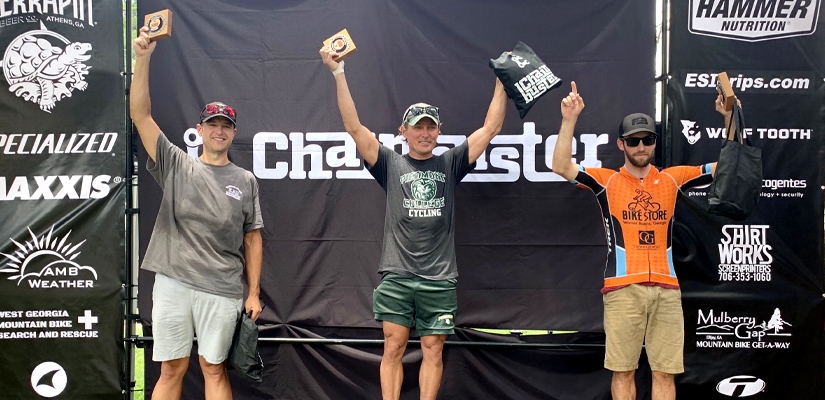 This is a picture of Jesse Fortson on the podium  with two other riders after a gravel race after using cycling for weight loss. 