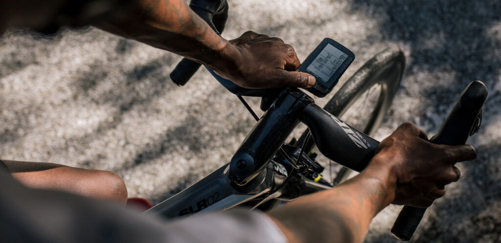 Races are cancelled. An athlete looks at their computer as they consider whether to continue their training plan or restart base training.