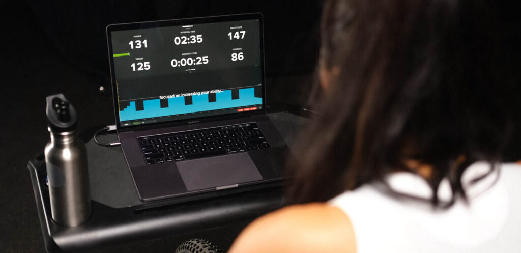 A cyclist riding an structured TrainerRoad indoor workout.
