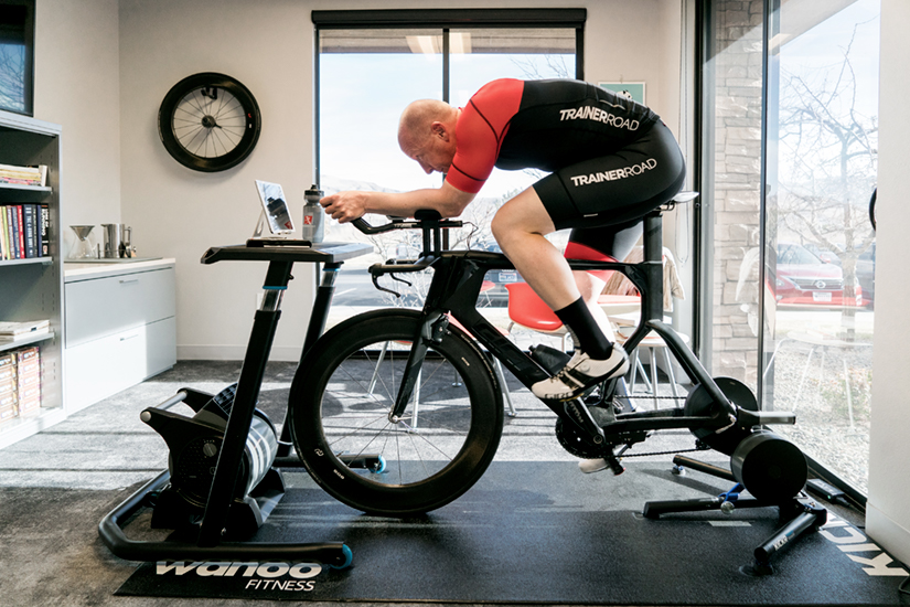 Coach Chad is riding on the trainer and a fan is placed directly in front of the front wheel.